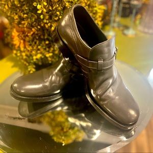 Gray, leather loafers with buckle.